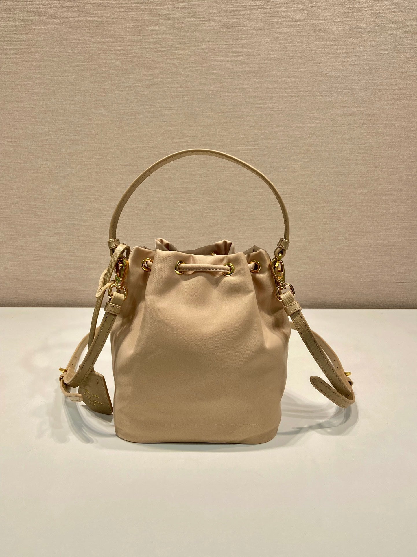 BUCKET BAG 19 IN BEIGE RE-NYLON AND SAFFIANO LEATHER HANDLE mysite