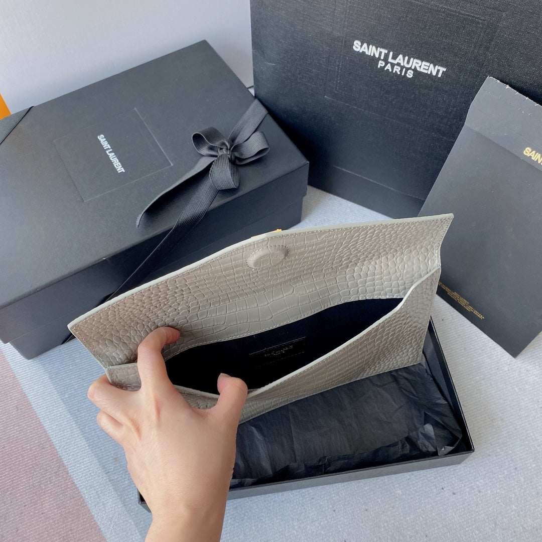 UPTOWN POUCH 27 IN PASTEL GRAY CROCODILE-EMBOSSED SHINY CALFSKIN GOLD LOGO mysite