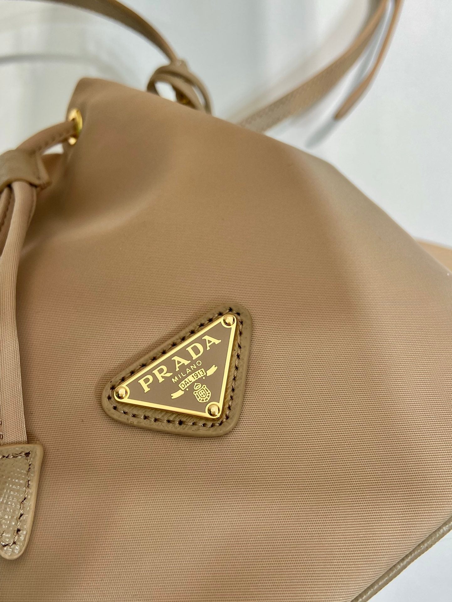 BUCKET BAG 19 IN BEIGE RE-NYLON AND SAFFIANO LEATHER HANDLE mysite