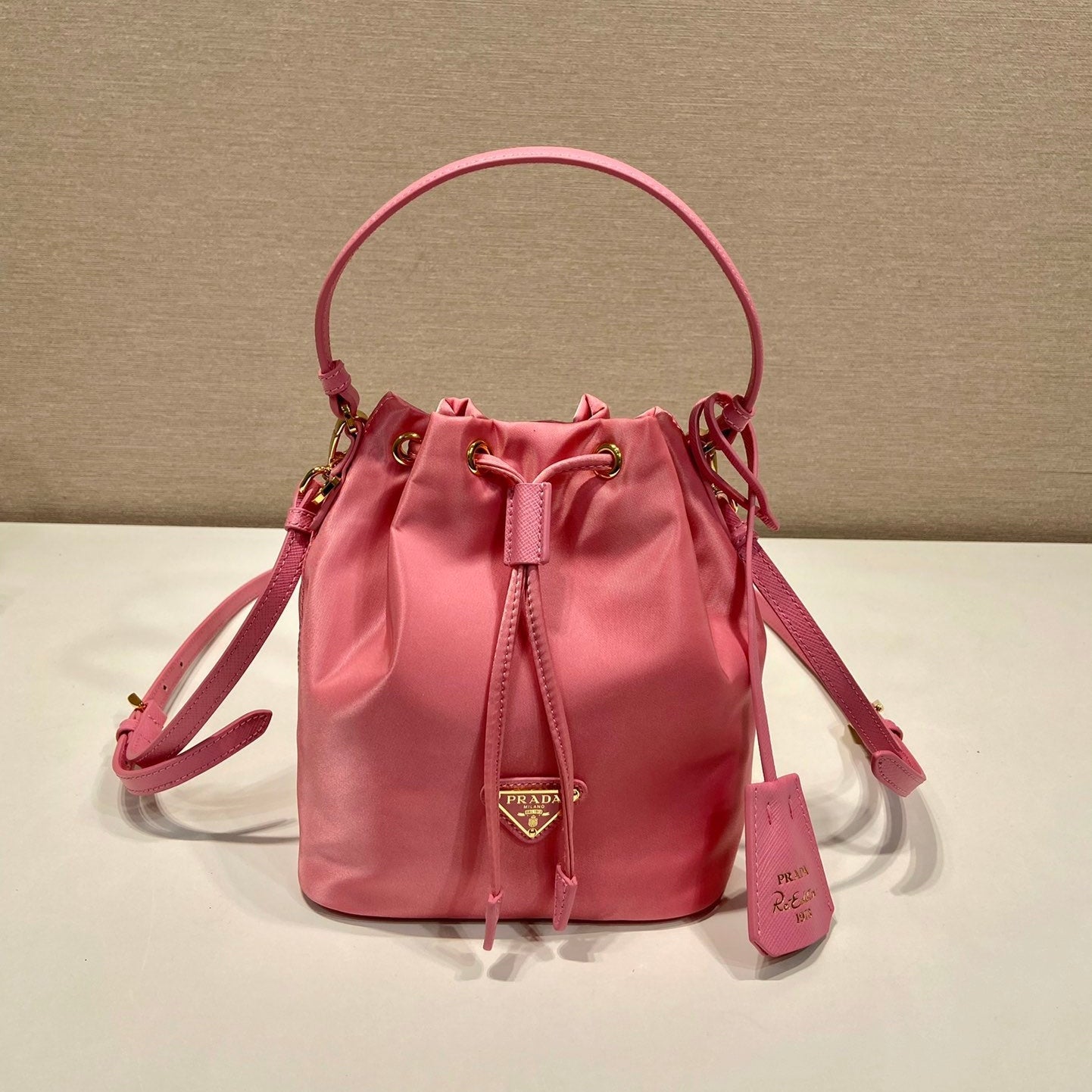 BUCKET BAG 19 IN CANDY PINK RE-NYLON AND SAFFIANO LEATHER HANDLE mysite