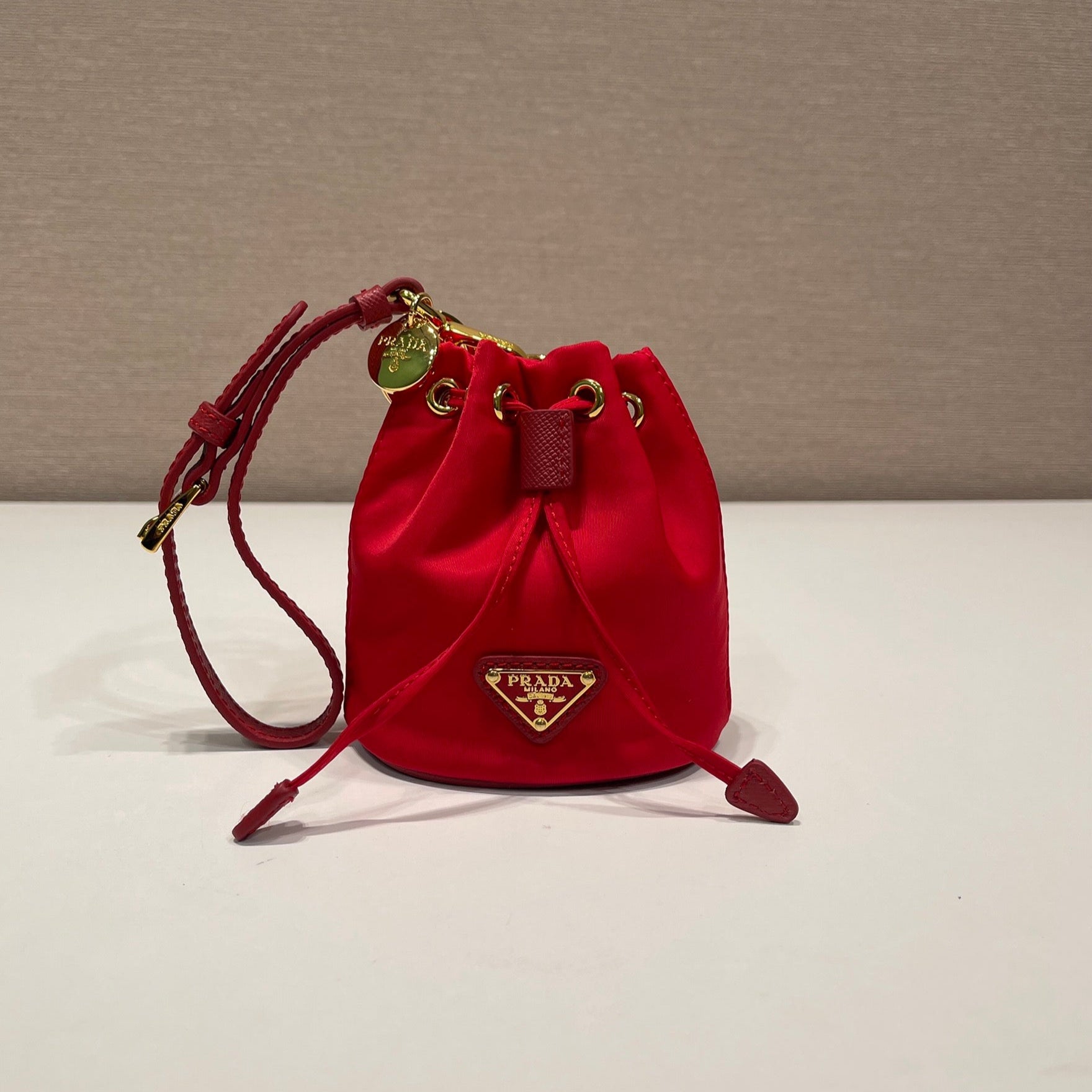 MINI BUCKET BAG 10 IN RED RE-NYLON AND SAFFIANO LEATHER STRAP mysite